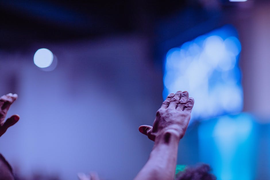 Hands raised praise service
