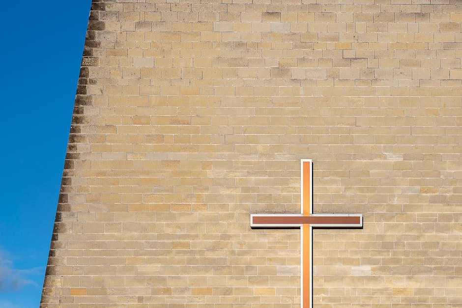 Faith community symbolized by a cross against the blue sky