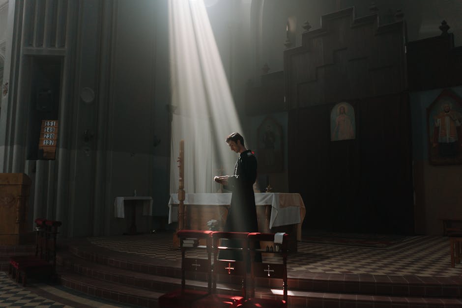 Priest reading bible sunlight