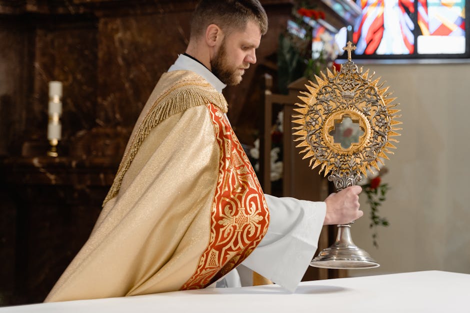 Priest vestments holding monstrance