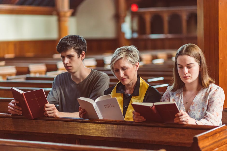 Three people reading bibles